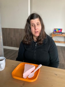 A photo of me in front of the cheesecake